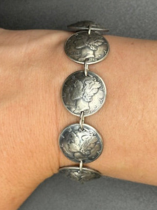 U.S. Mercury Dime Silver Coin Bracelet on a wrist on a black background. - Mountainstruck Coin Jewelry