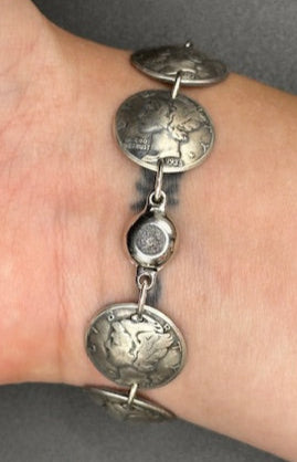 U.S. Mercury Dime Silver Coin Bracelet on a wrist showing magnetic clasp on a black background. - Mountainstruck Coin Jewelry