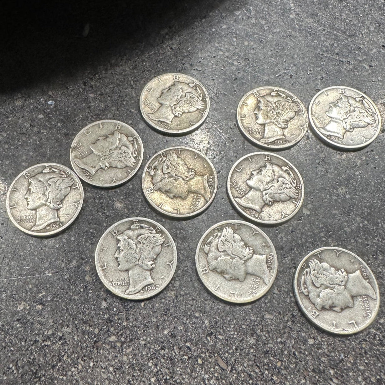 Mercury Silver Dime Coins on a concrete surface - Mountainstruck Coin Jewelry