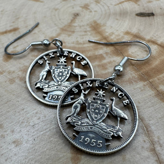 Australia Emu & Kangaroo Hand Cut Silver Coin Earrings on a wood background. - Mountainstruck Coin Jewelry