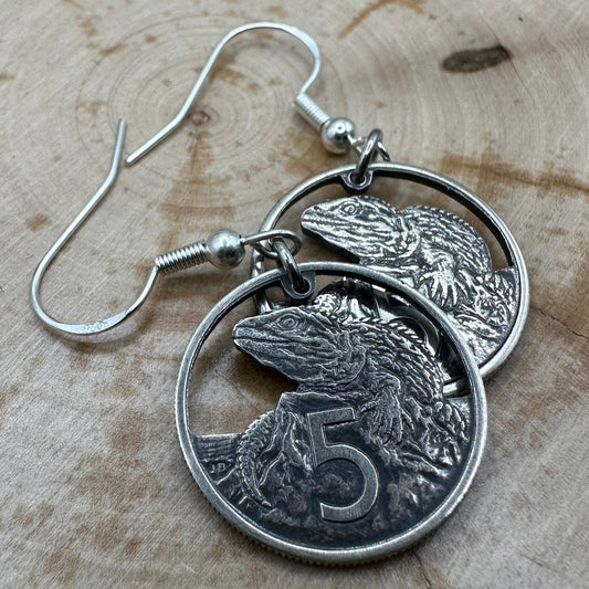 New Zealand Tuatara 5 Cents Hand Cut Coin Earrings on wood background. - Mountainstruck Coin Jewelry