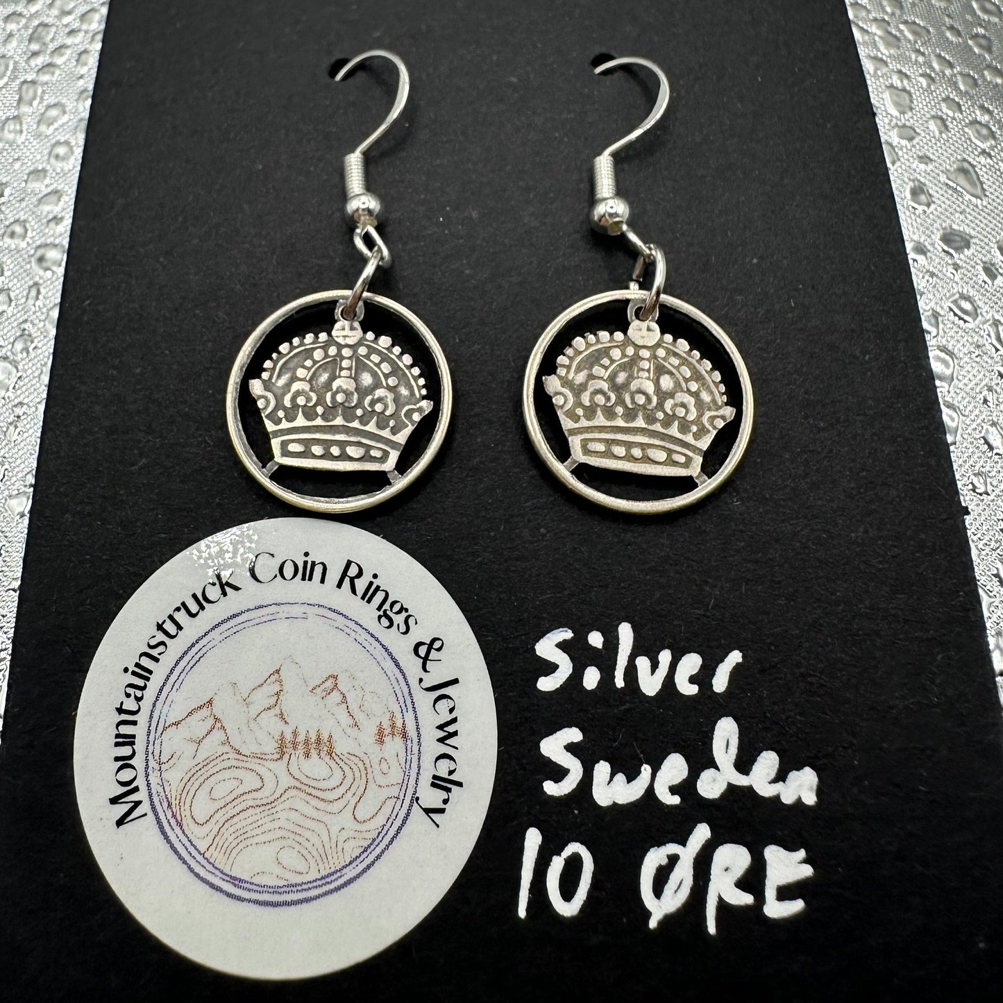 Sweden Crown 10 Ore Hand Cut Silver Coin Earrings on a black background. - Mountainstruck Coin Jewelry