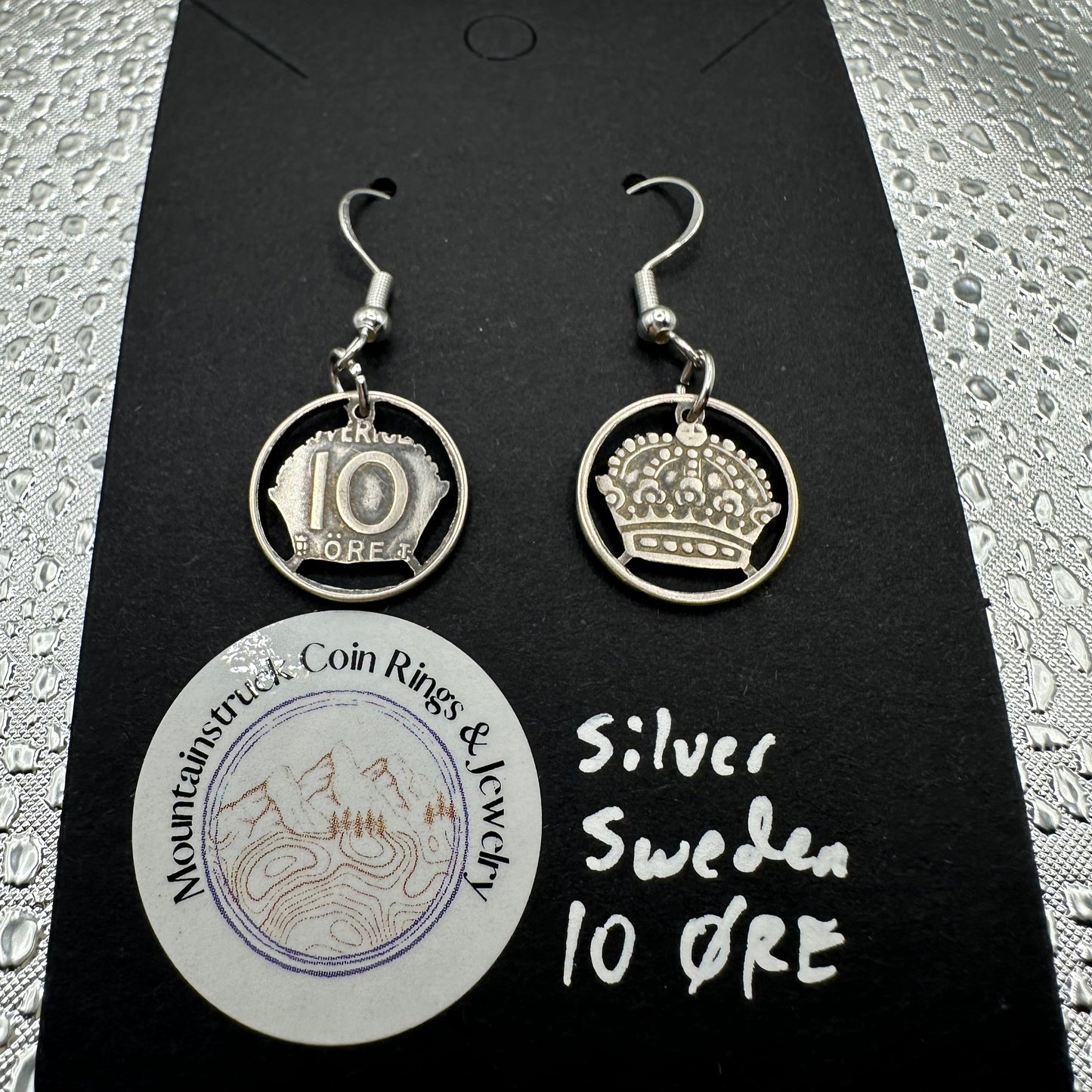 Sweden Crown 10 Ore Hand Cut Silver Coin Earrings on a black background - Mountainstruck Coin Jewelry
