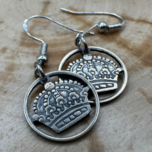 Sweden Crown 10 Ore Hand Cut Silver Coin Earrings on a wood background. - Mountainstruck Coin Jewelry