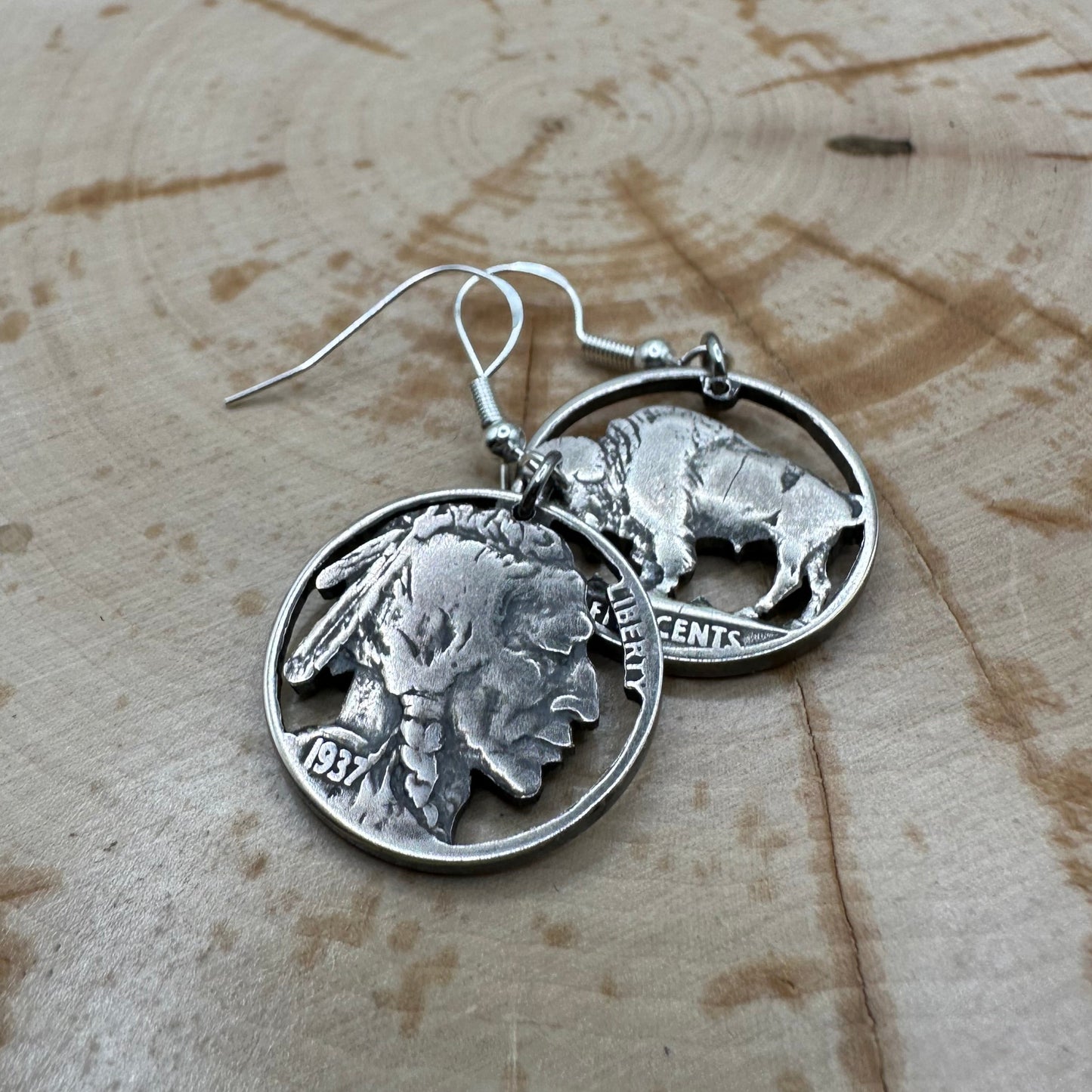 U.S. Buffalo Nickel Hand Cut Coin Earrings (combo) with sterling silver earring hooks on a wood background. - Mountainstruck Coin Jewelry
