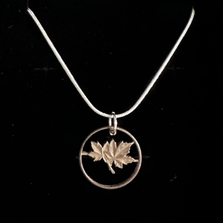 Canada Maple Leaf Penny Hand Cut Coin Necklace on a black velvet background. - Mountainstruck Coin Jewelry