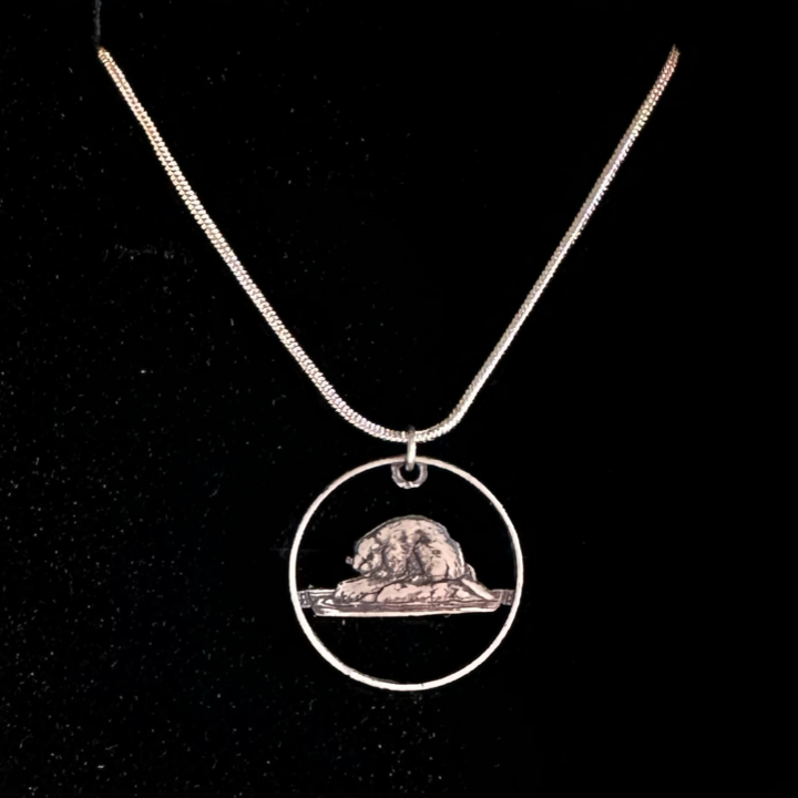 Canadian Nickel Beaver Hand Cut Coin Necklace with a black velvet background. - Mountainstruck Coin Jewelry