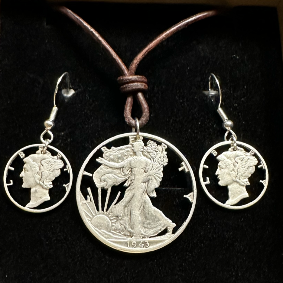 U.S. Lady Liberty Silver Hand Cut Coin Collection (leather cord) in a brown kraft box on a black velvet background. - Mountainstruck Coin Jewelry