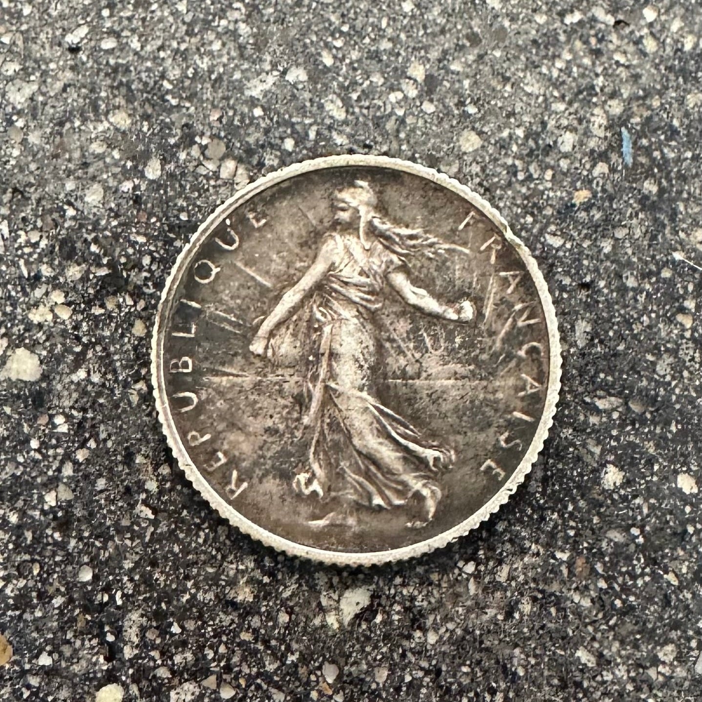 France 1 Franc Silver Coin front on a concrete background. - Mountainstruck Coin Jewelry