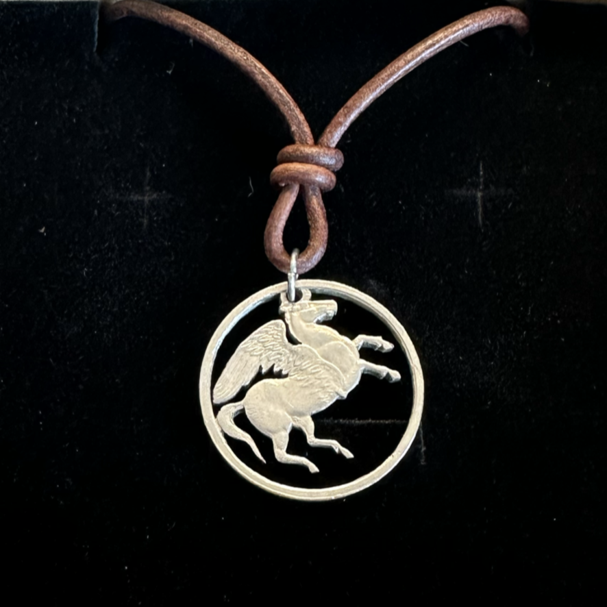 Greece Pegasus 5 Drachmai Hand Cut Coin Necklace with leather cord on a black velvet background. - Mountainstruck Coin Jewelry