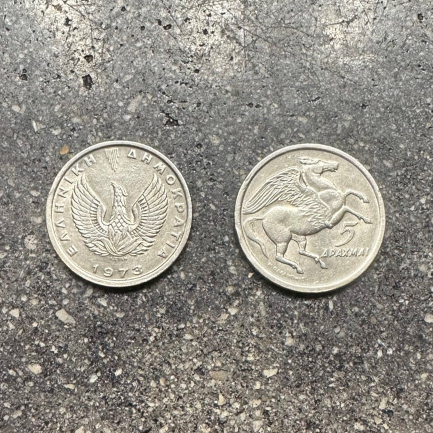 Greece Pegasus 5 Drachmai Coin on a concrete background. Front side of coin on the left and back side of coin on the right side of the picture. - Mountainstruck Coin Jewelry