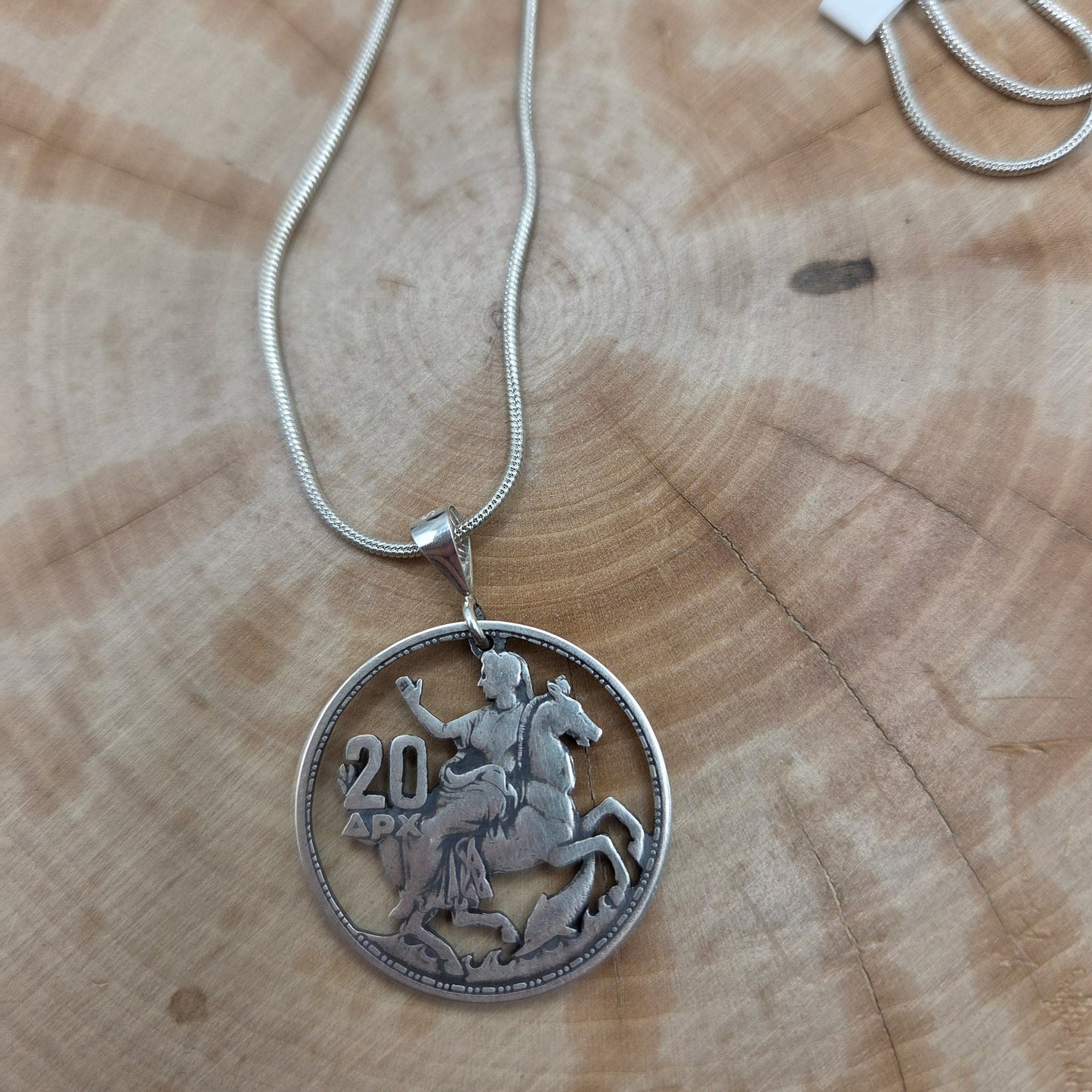 Greek 20 Drachmai Hand Cut Silver Coin Necklace on wood background. - Mountainstruck Coin Jewelry