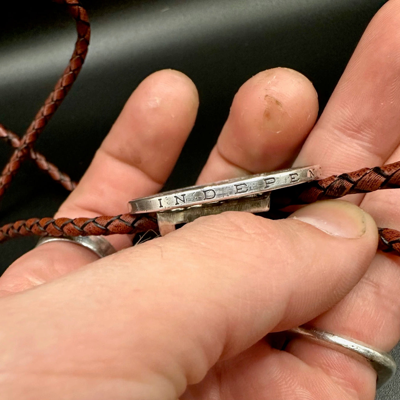 Mexico 25 Pesos Silver Hand Cut Coin Bolo Tie with darker brown leather cord - Mountainstruck Coin Jewelry