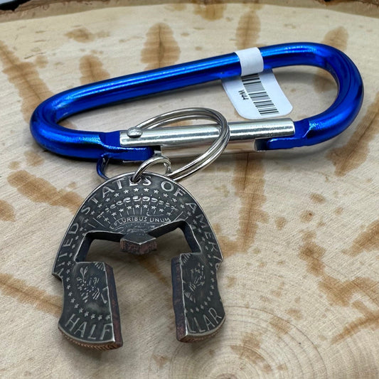 Hand cut and molded Spartan Helmet made from a U.S. Half Dollar on a blue carabiner . - Mountainstruck Coin Jewelry