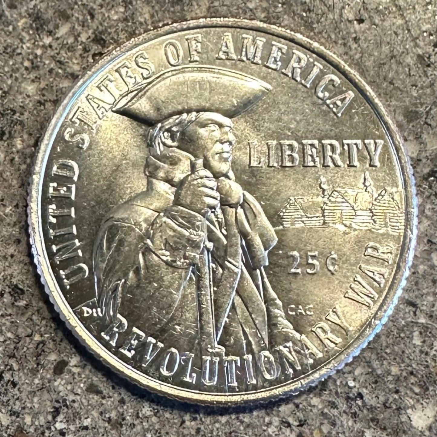 U.S. 2026 "Revolutionary War" Quarter Coin back on a concrete background. - Mountainstruck Coin Jewelry