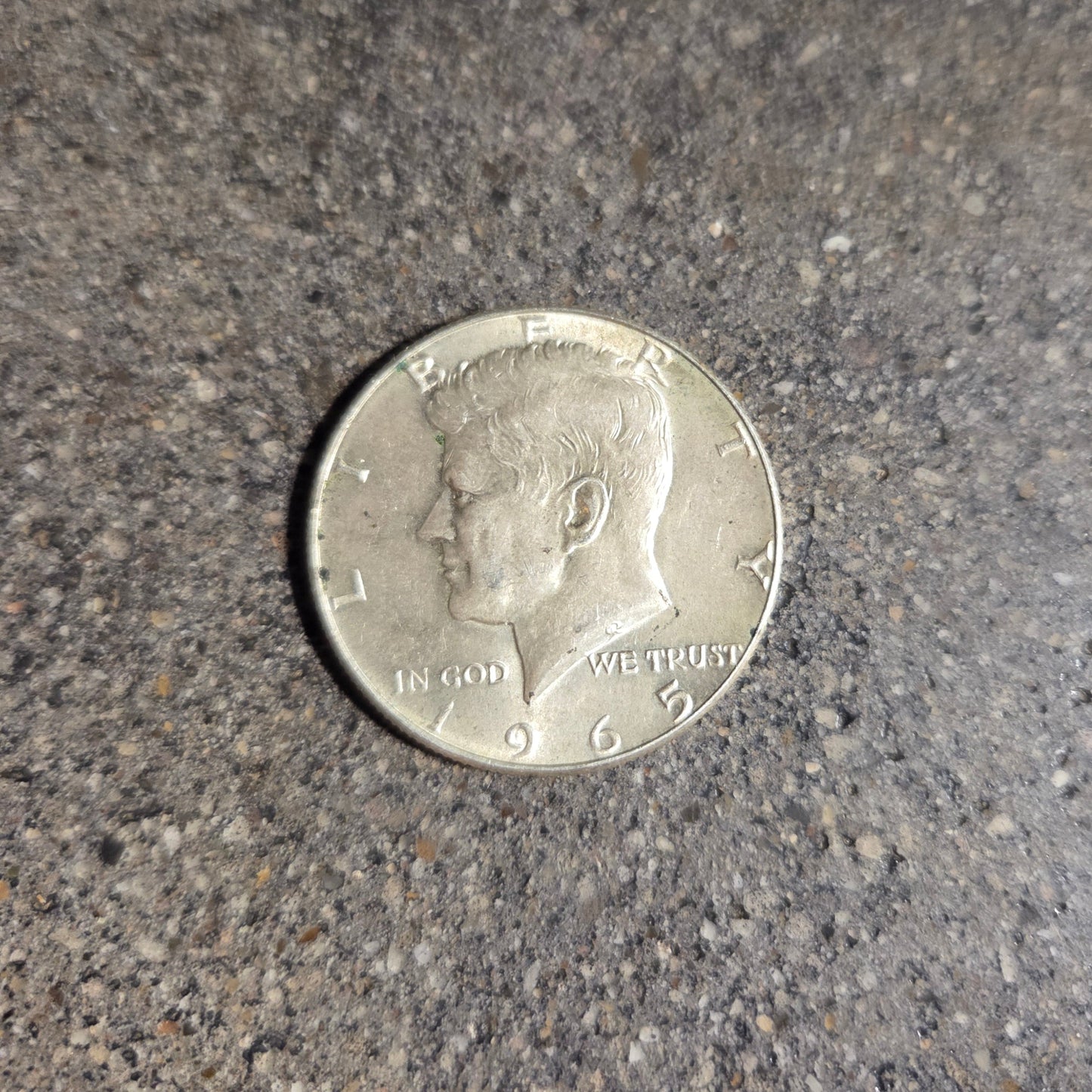 U.S. JFK Eagle Half Dollar Silver Coin front on a concrete background. - Mountainstruck Coin Jewelry