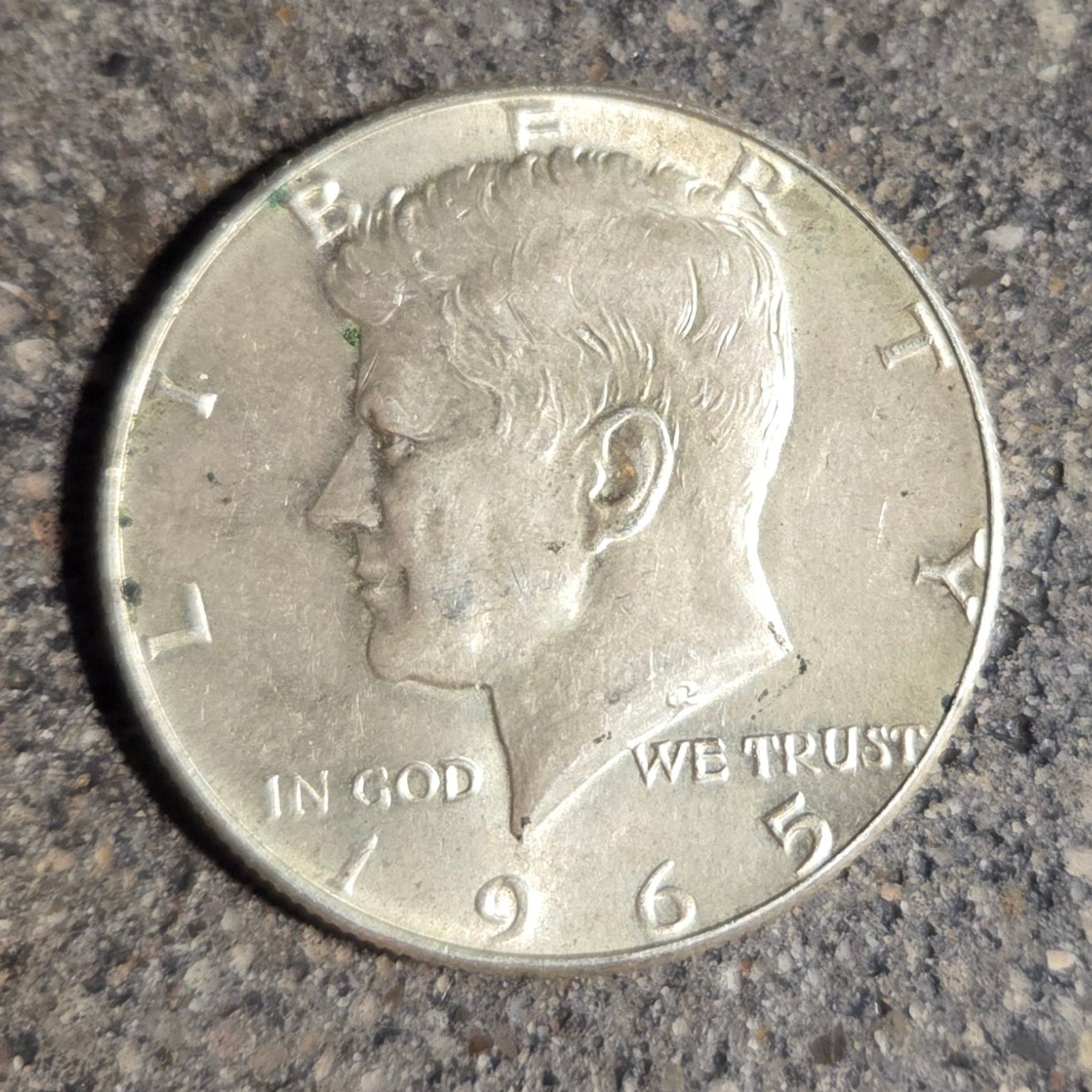 U.S. JFK Eagle Half Dollar Silver Coin front on a concrete background. - Mountainstruck Coin Jewelry