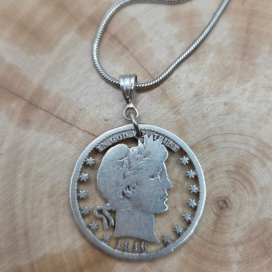 U.S. Barber Quarter Hand Cut Silver Coin Necklace with a snake chain on a wood background. -Mountainstruck Coin Jewelry