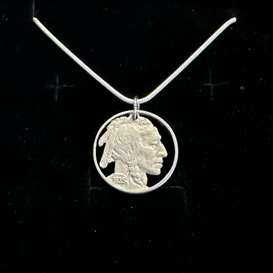 U.S. Buffalo Nickel Hand Cut Coin Necklace (Front) with a snake chain on black velvet background. - Mountainstruck Coin Jewelry
