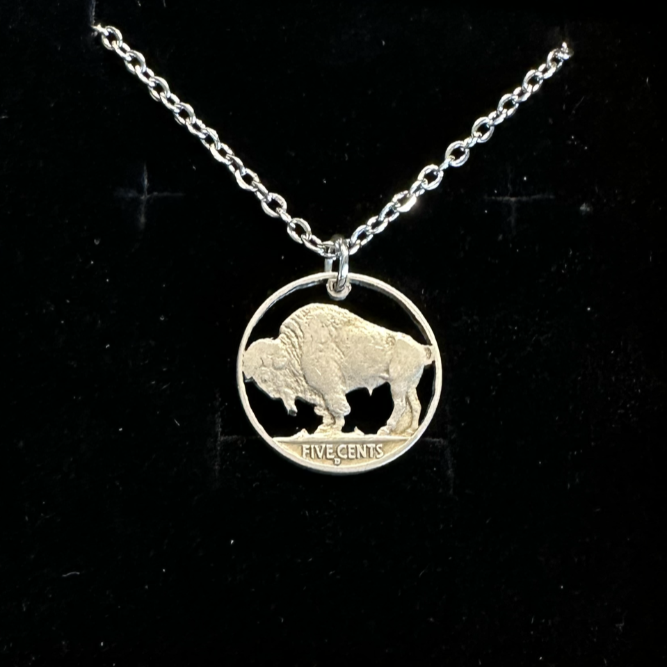 U.S. Buffalo Nickel Hand Cut Coin Necklace (Back) with a stainless chain in a brown kraft box on a black velvet background. - Mountainstruck Coin Jewelry