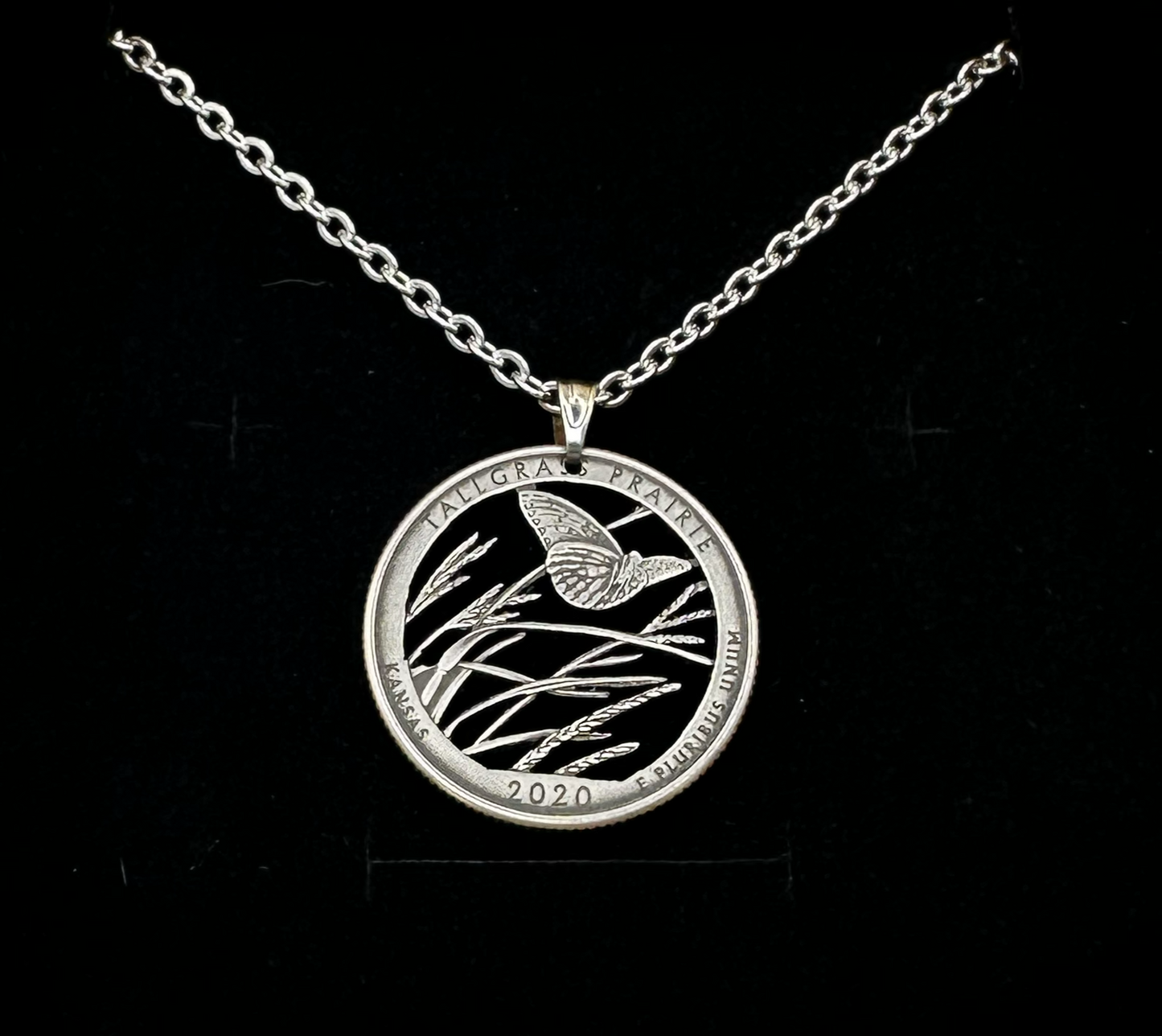 U.S. Butterfly Tallgrass Prairie Quarter Hand Cut Coin Necklace with a stainless chain on a black velvet background - Mountainstruck Coin Jewelry