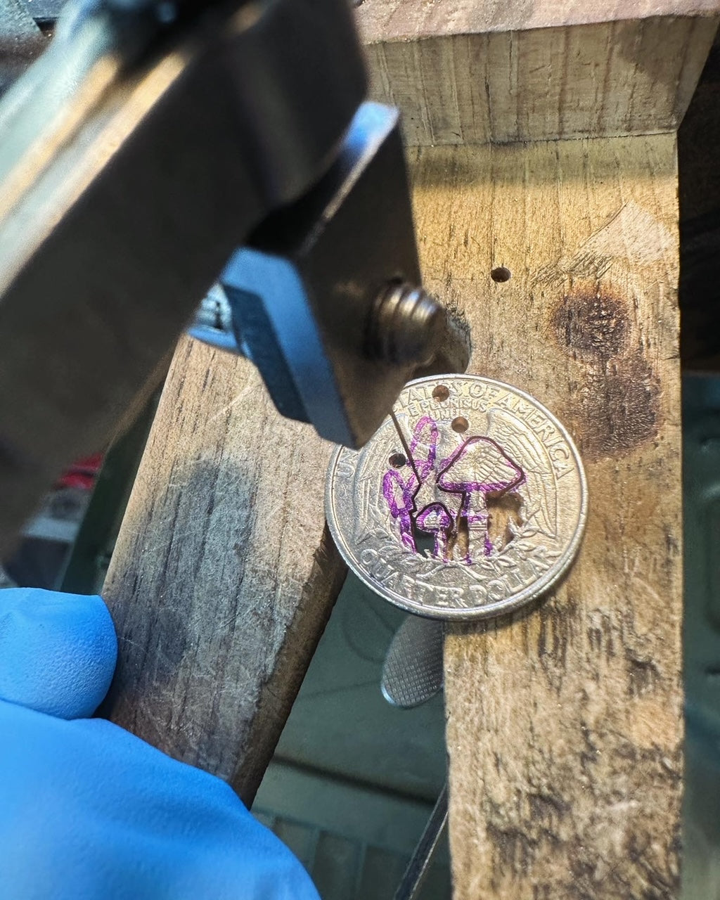 U.S. Custom Mushroom Quarter during the hand cutting process on a wood block. - Mountainstruck Coin Jewelry