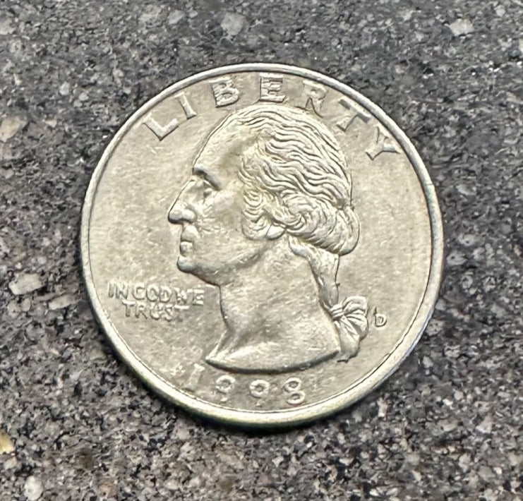 Front of U.S. Quarter on a concrete background. - Mountainstruck Coin Jewelry