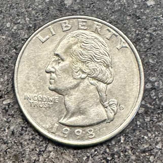 Front of U.S. Quarter on a concrete background. - Mountainstruck Coin Jewelry