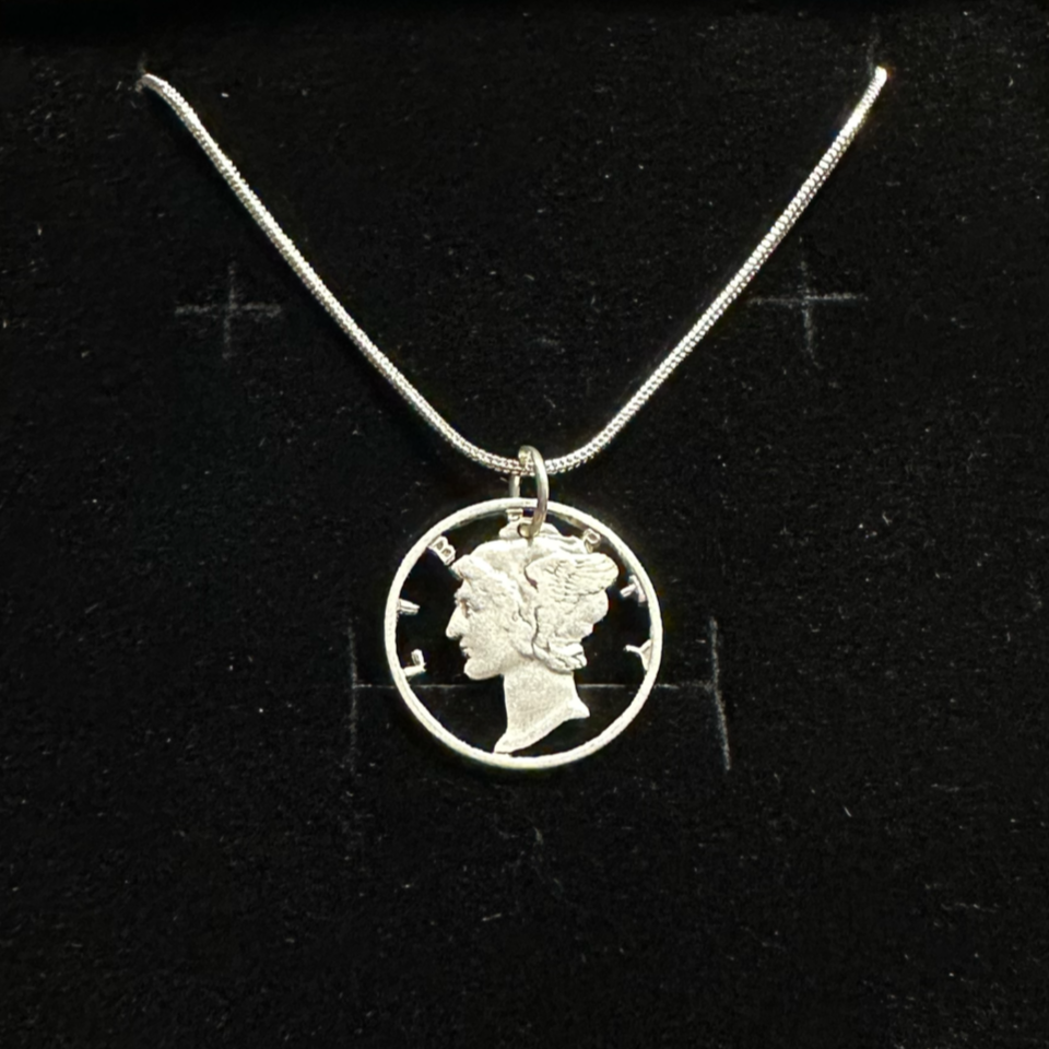 U.S. Mercury Dime Silver Hand Cut Coin Necklace (snake chain) in a brown kraft box on a black velvet background. - Mountainstruck Coin Jewelry