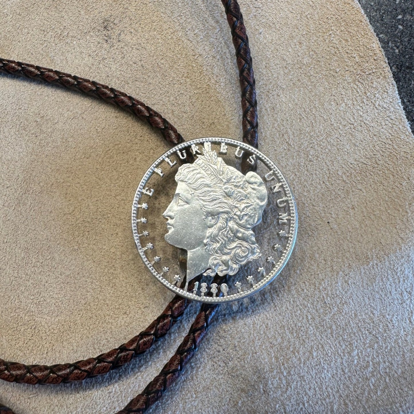 U.S. Morgan Dollar Hand Cut Silver Coin Bolo Tie (front) - Mountainstruck Coin Jewelry