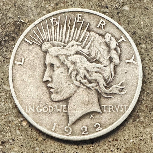 U.S. Peace Dollar Silver Coin
front on a concrete background. - Mountainstruck Coin Jewelry