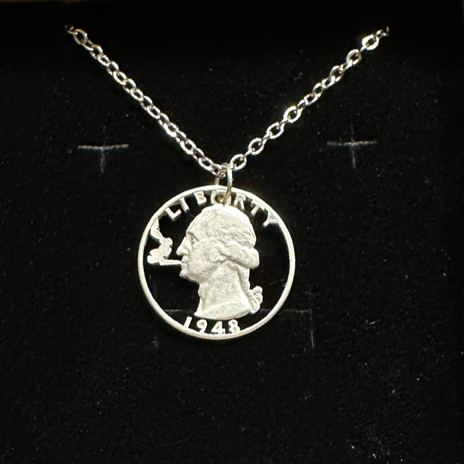 U.S. Smoking GW Silver Quarter Hand Cut Coin Necklace with a stainless chain on a black velvet background. - Mountainstruck Coin Jewelry