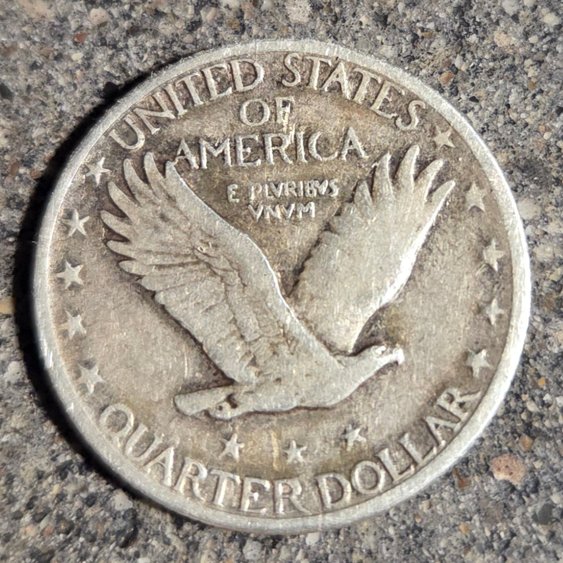 U.S. Soaring Eagle Quarter Silver Coin back on a concrete background. - Mountainstruck Coin Jewelry
