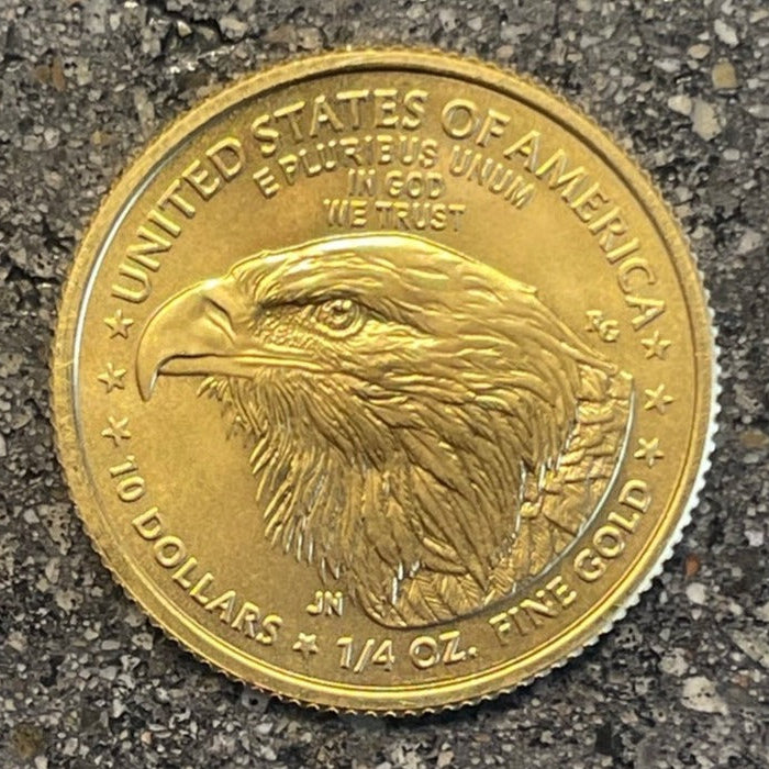 22k Gold U.S. Gold Eagle Coin front on a concrete background. - Mountainstruck Coin Jewelry