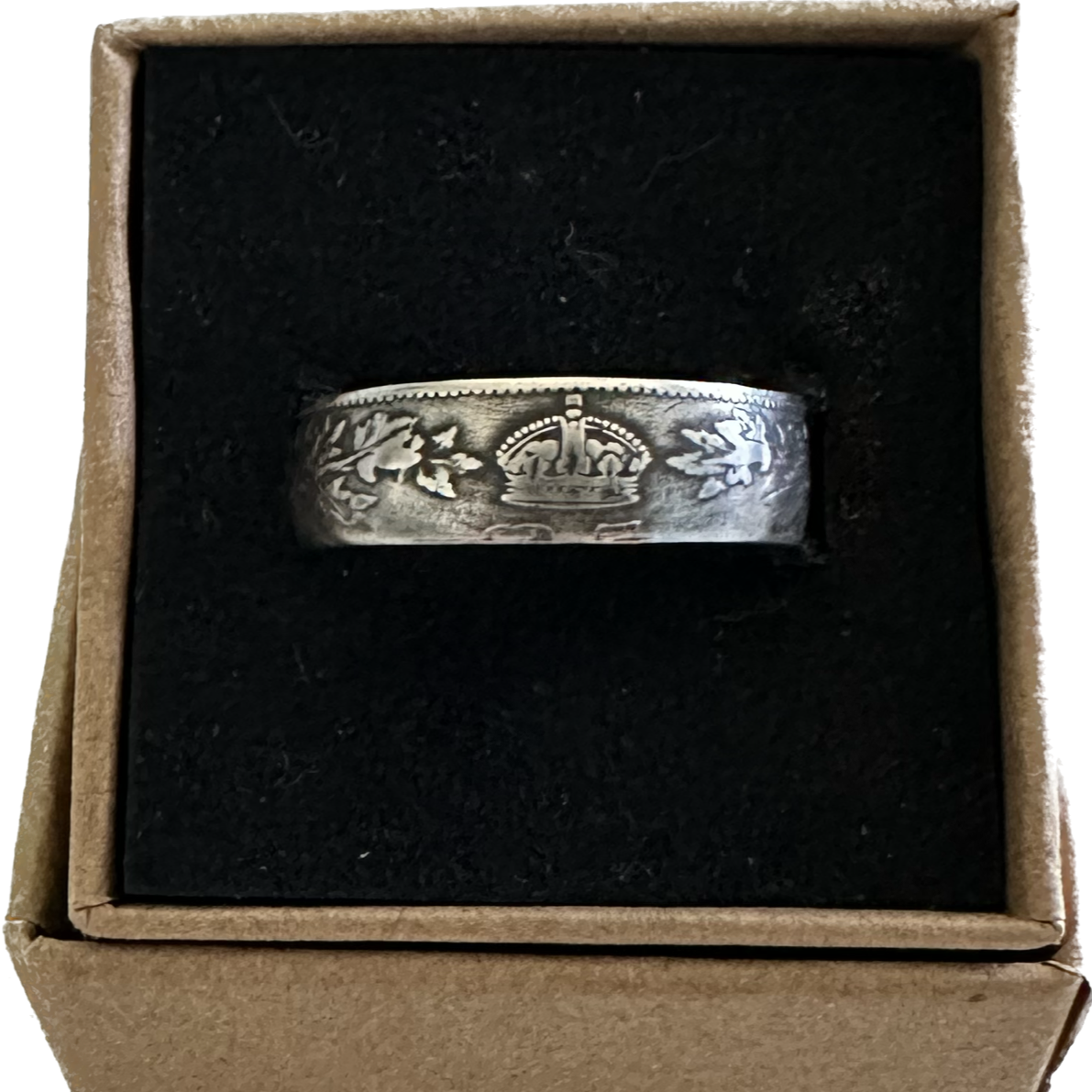 Canada 25 Cents Maple Leaf Silver Coin Ring in a brown kraft box on a black velvet background. - Mountainstruck Coin Jewelry