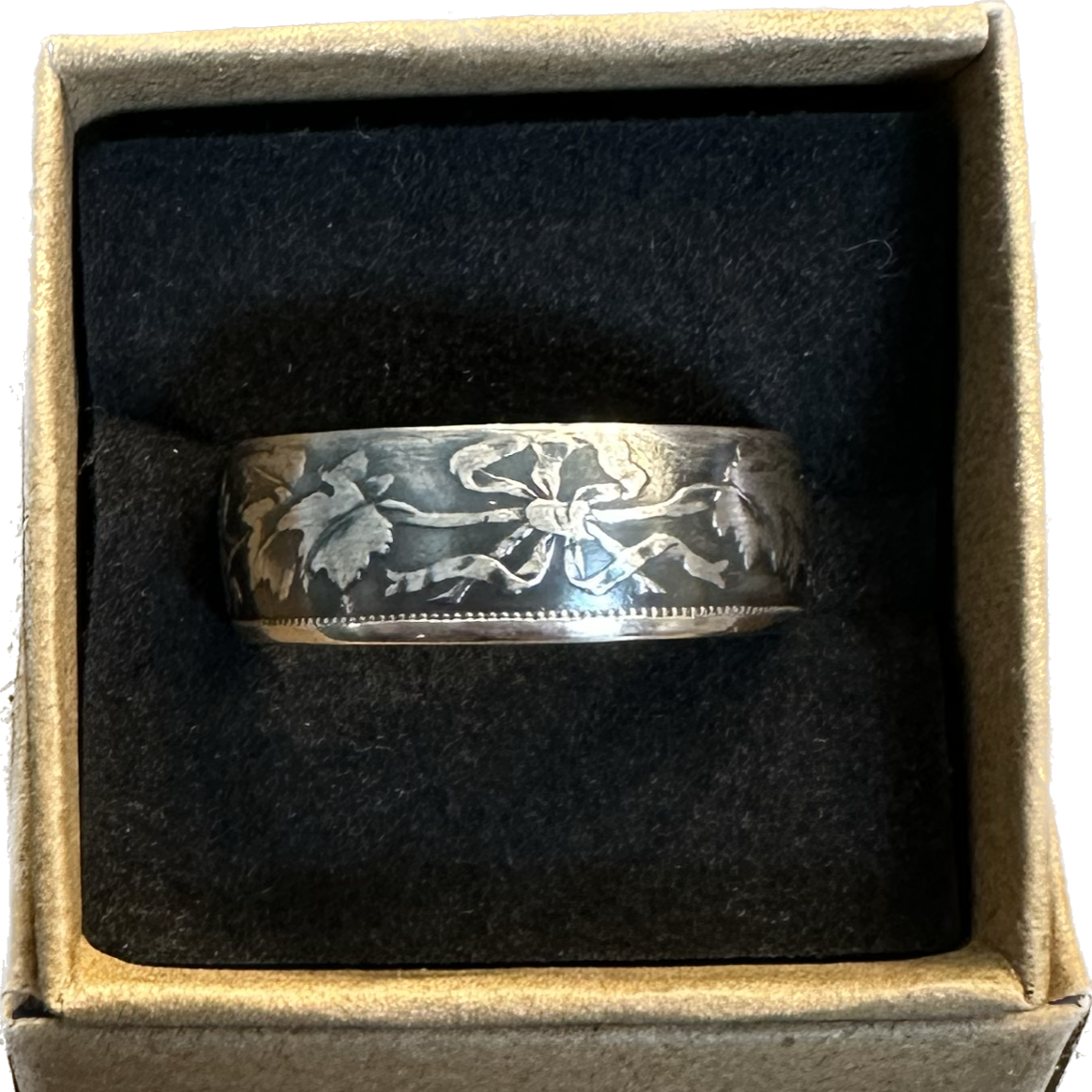 Canada 50 Cents Maple Leaf Silver Coin Ring in a brown kraft box on a black velvet background. - Mountainstruck Coin Jewelry