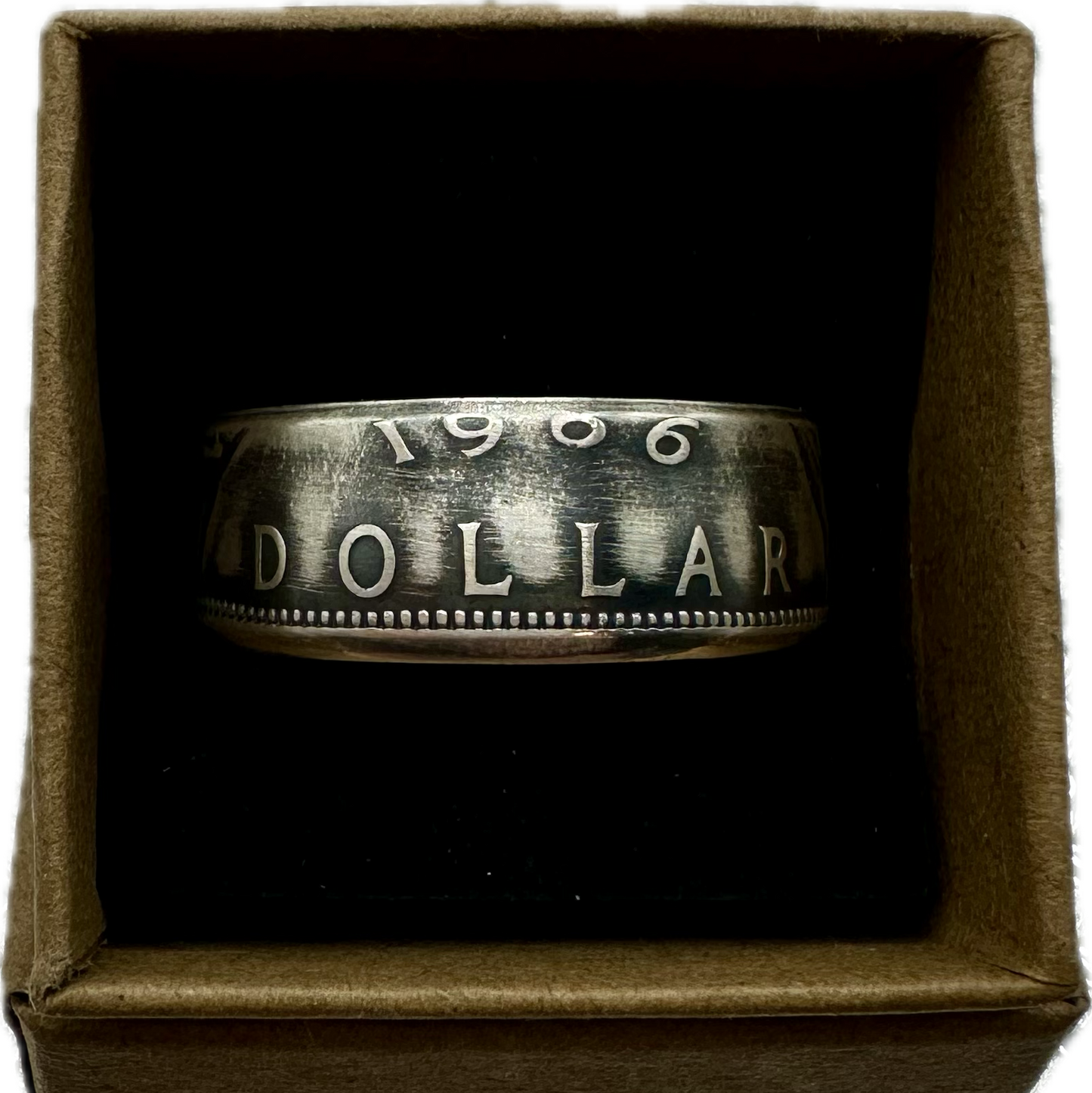 Canada Dollar Silver Coin Ring in a brown kraft box on a black velvet background. - Mountainstruck Coin Jewelry