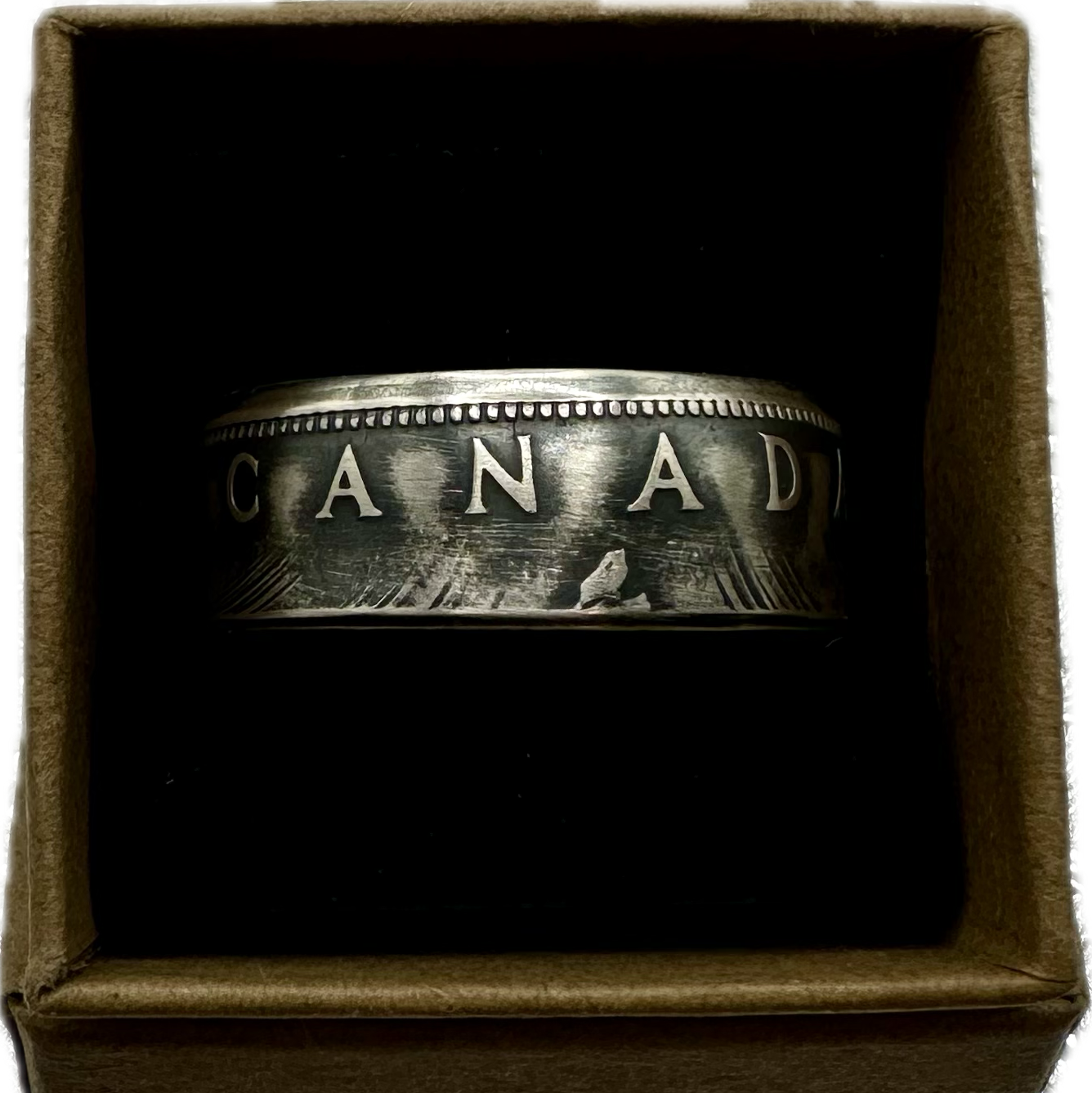 Canada Dollar Silver Coin Ring in a brown kraft box on a black velvet background. - Mountainstruck Coin Jewelry