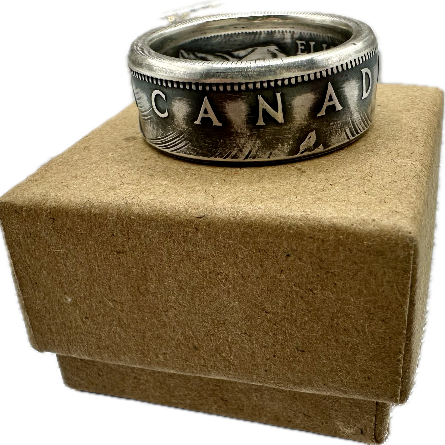 Canada Dollar Silver Coin Ring on a brown kraft box. - Mountainstruck Coin Jewelry