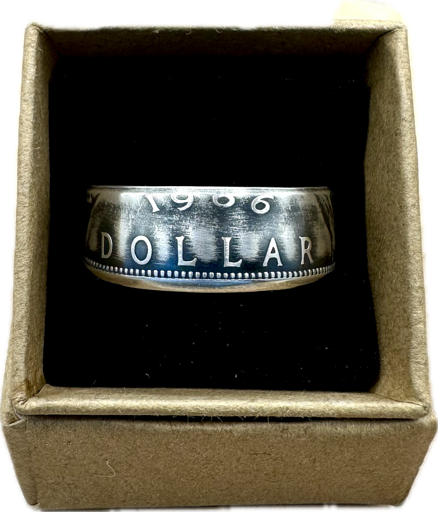 Canada Dollar Silver Coin Ring in a brown kraft box on a black velvet background. - Mountainstruck Coin Jewelry