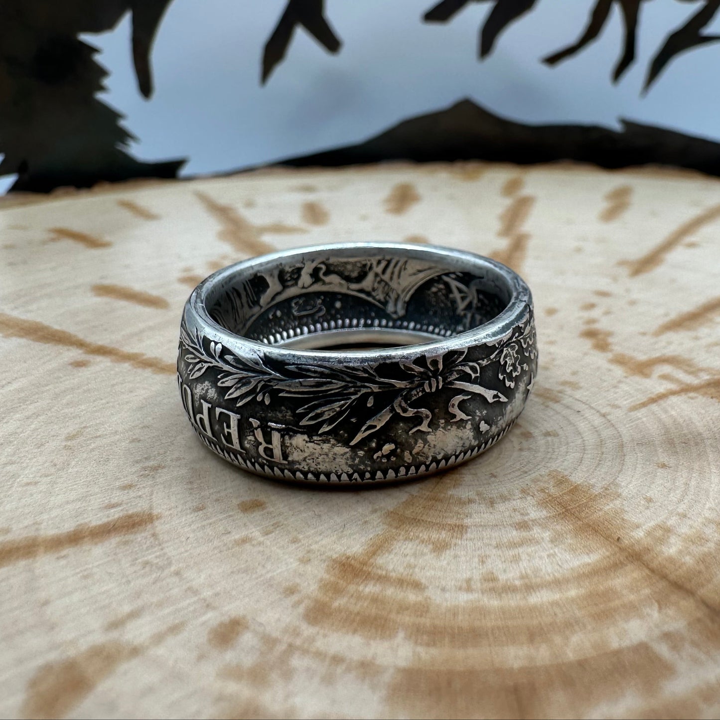 France Silver 10 Francs Coin Ring on a wood background. - Mountainstruck Coin Jewelry