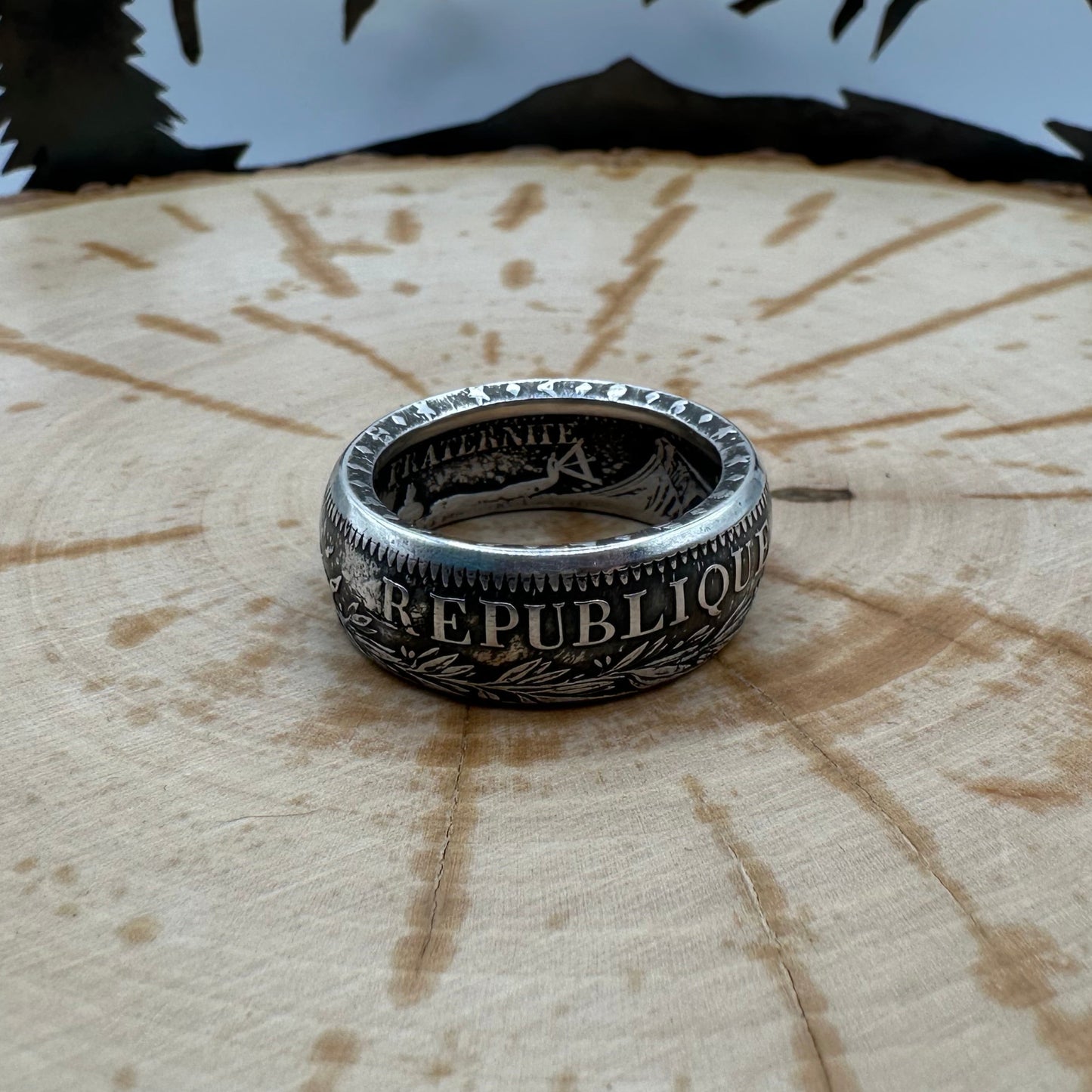 France Silver 10 Francs Coin Ring on a wood background. - Mountainstruck Coin Jewelry