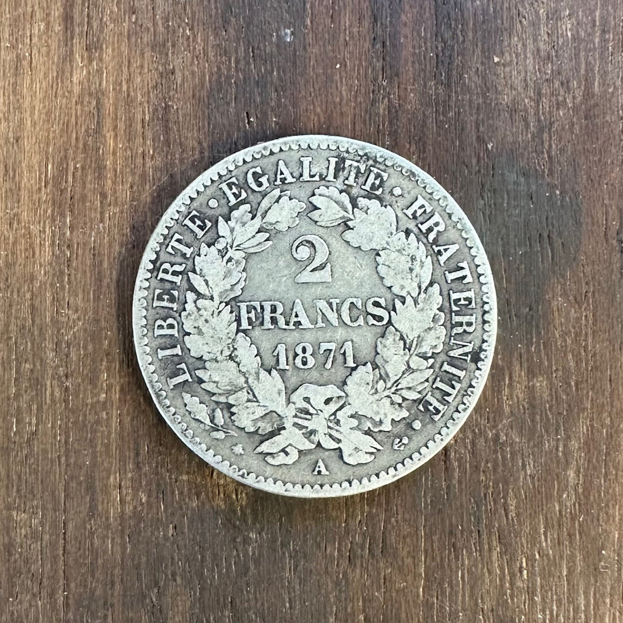 France 2 Franc Silver Coin back on a dark wood background. - Mountainstruck Coin Jewelry