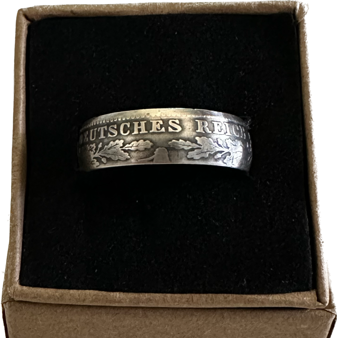 Germany 1 Mark Silver Coin Ring in a brown kraft box on a black velvet background. - Mountainstruck Coin Jewelry