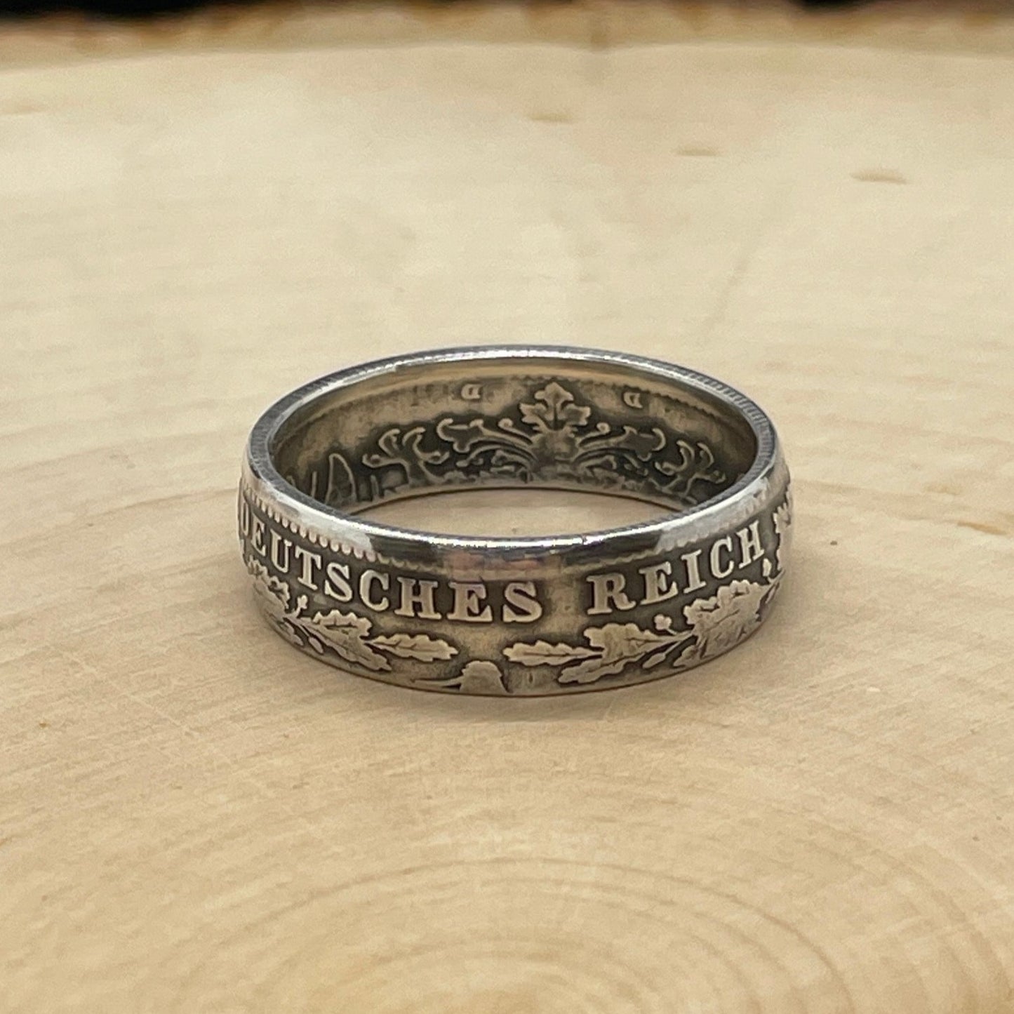 Germany 1 Mark Silver Coin Ring on a light wood round. - Mountainstruck Coin Jewelry