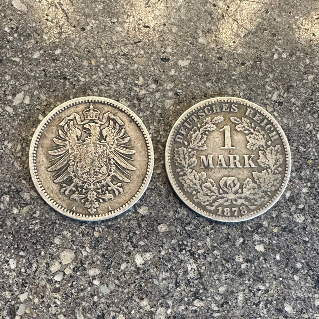 Germany 1 Mark Silver Coin on a concrete background. Front of coin on left side and back of the coin on the right side of the picture. - Mountainstruck Coin Jewelry