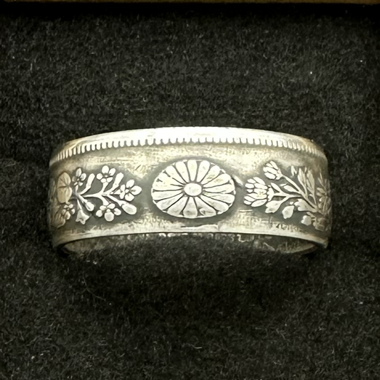 Japan 50 Sen Silver Coin Ring in a brown kraft box on a black velvet background. - Mountainstruck Coin Jewelry