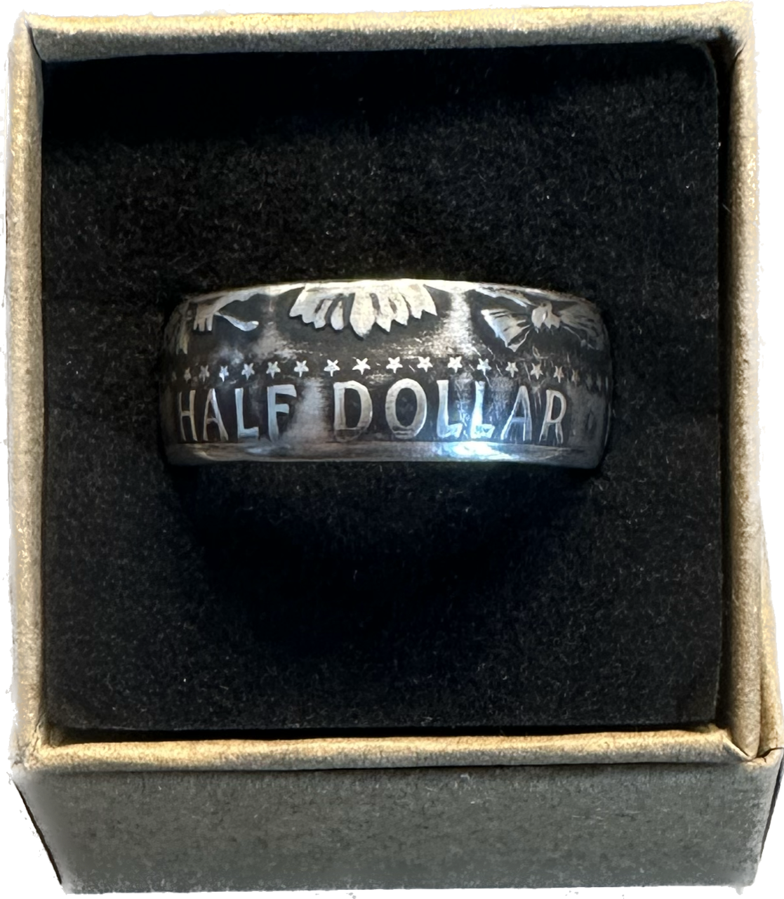 JFK Silver Half Dollar Coin Ring (reverse) in a brown kraft box on a black velvet background. - Mountainstruck Coin Jewelry