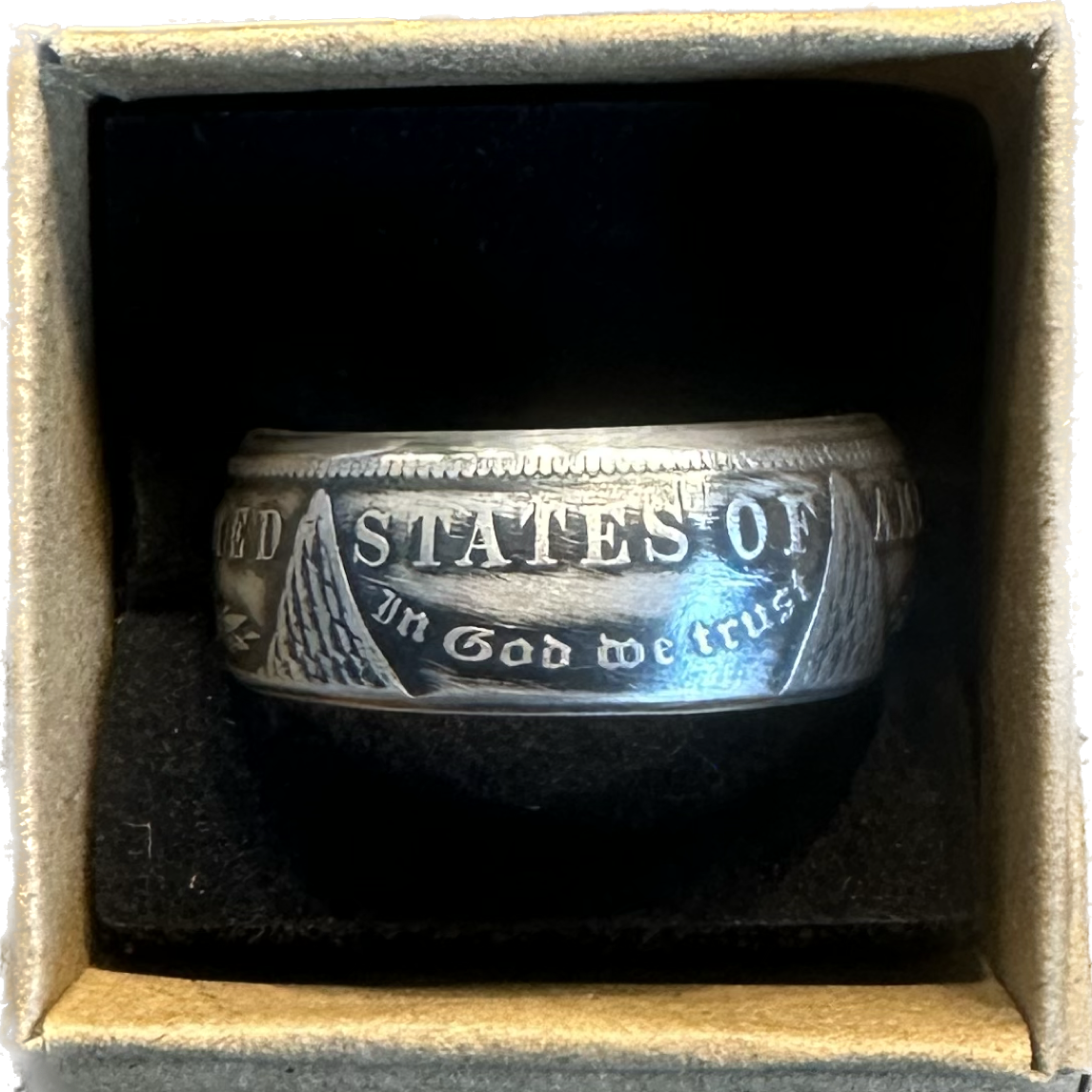 Morgan Dollar Silver Coin Ring in a brown kraft box on a black velvet background. - Mountainstruck Coin Jewelry