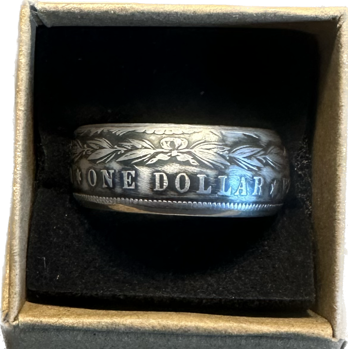 Morgan Dollar Silver Coin Ring in a brown kraft box on a black velvet background. - Mountainstruck Coin Jewelry